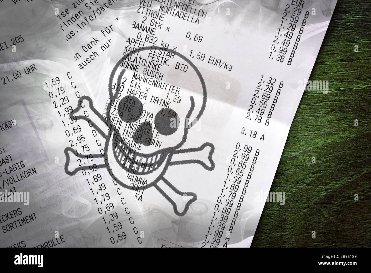 PHOTOMONTAGE, receipts with death's-head, symbolic photo for poison materials in thermo paper, FOTOMONTAGE, Kassenbons mit Totenkopf, Symbolfoto für G Stock Photo