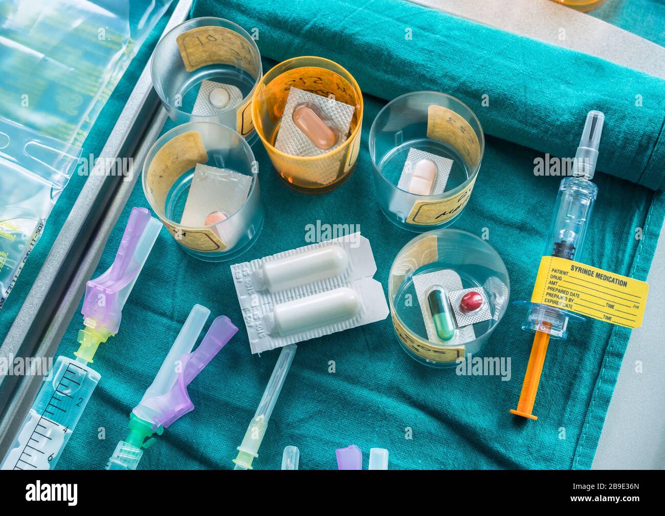 Syringes Loaded With Medication Next To Medicine Vials Prepared In