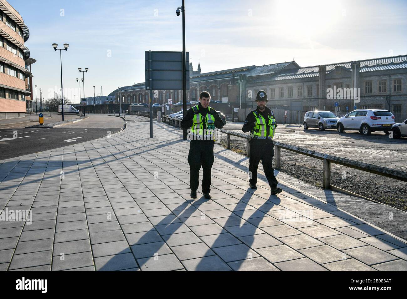 British Transport Police patrol the perimeter of Bristol Temple Meads train station, which is empty of rush-hour commuters and travelers at 8am the day after Prime Minister Boris Johnson put the UK in lockdown to help curb the spread of the coronavirus. Stock Photo