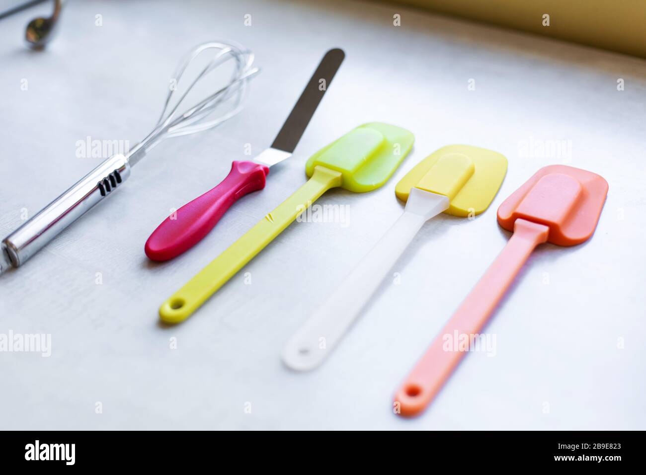 https://c8.alamy.com/comp/2B9E823/set-of-multi-colored-silicone-spatulas-kitchen-tools-sweet-pastries-recipes-cooking-2B9E823.jpg