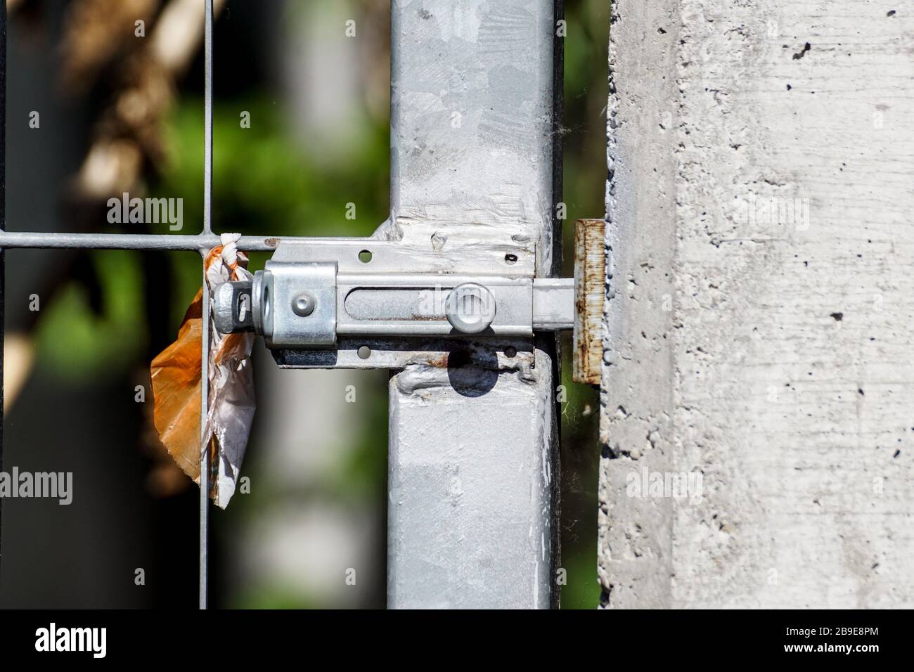 Silver door bolt on a wooden door . close up Stock Photo - Alamy