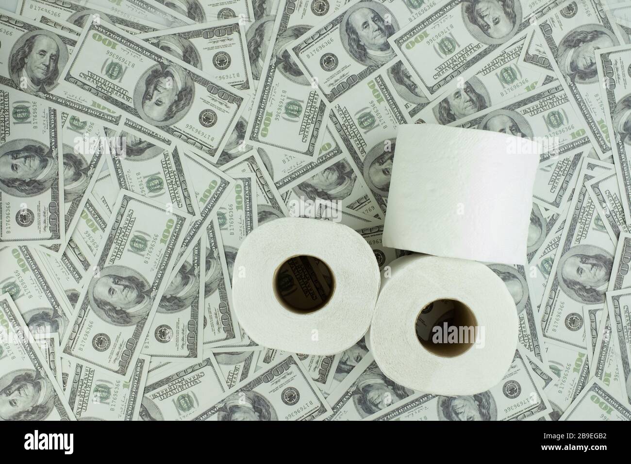 Toilet paper tissue and money of stack 100 US dollars banknote a lot of