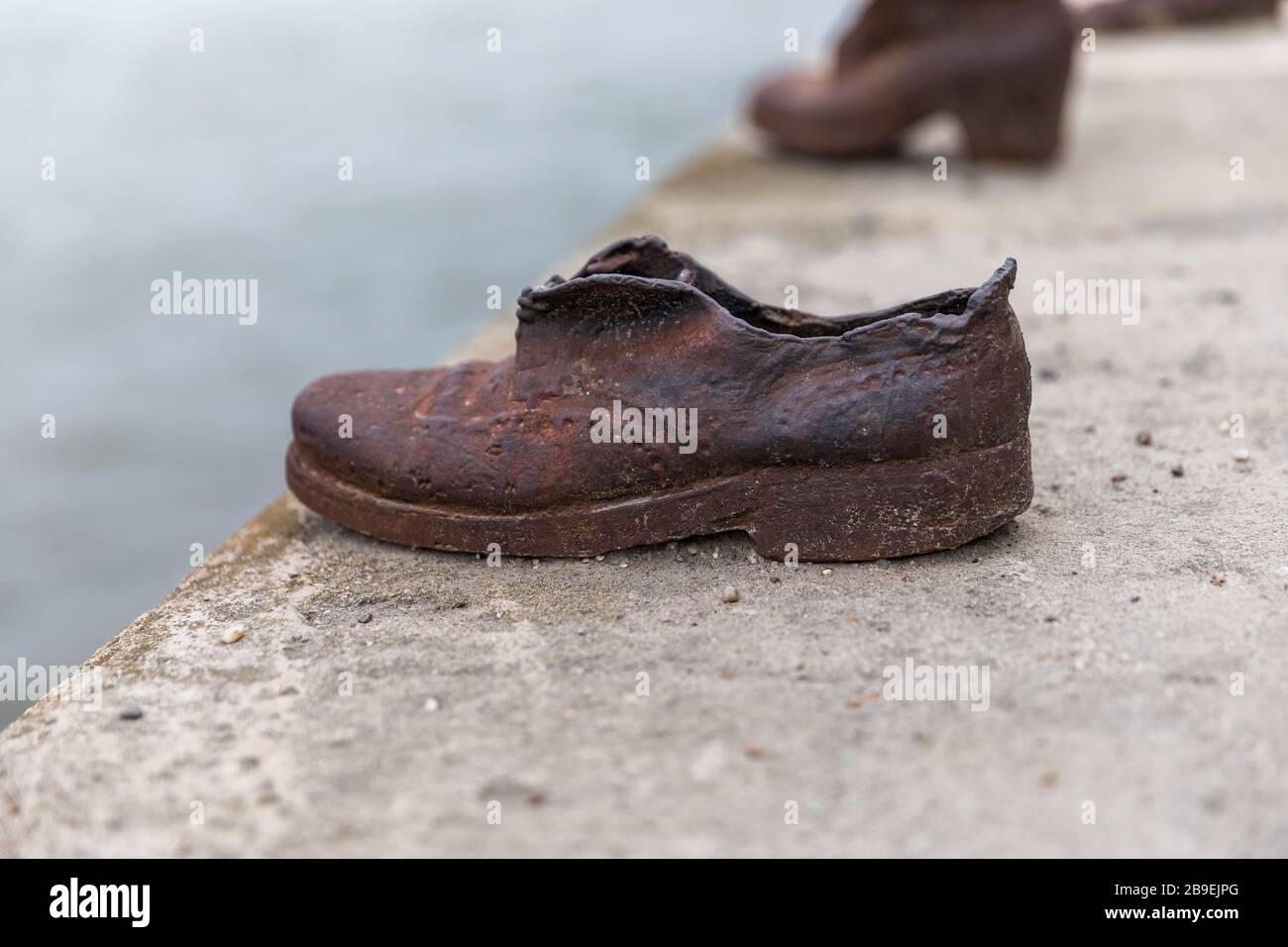 Old metal rusty shoes on the parapet of the Danube river embankment in  Budapest, Hungary. Monument to the victims Stock Photo - Alamy