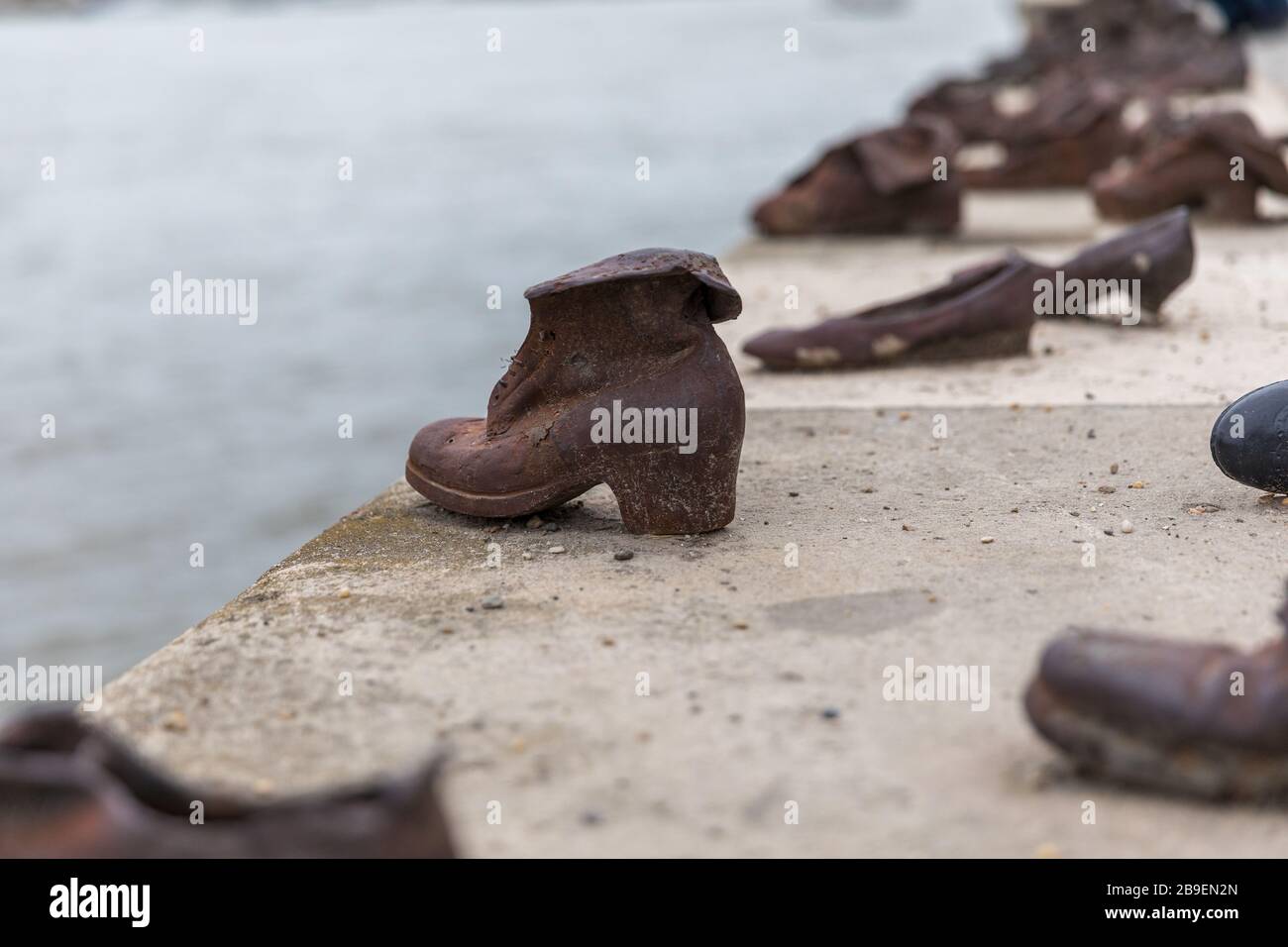 Old metal rusty shoes on the parapet of the Danube river embankment in  Budapest, Hungary. Monument to the victims Stock Photo - Alamy