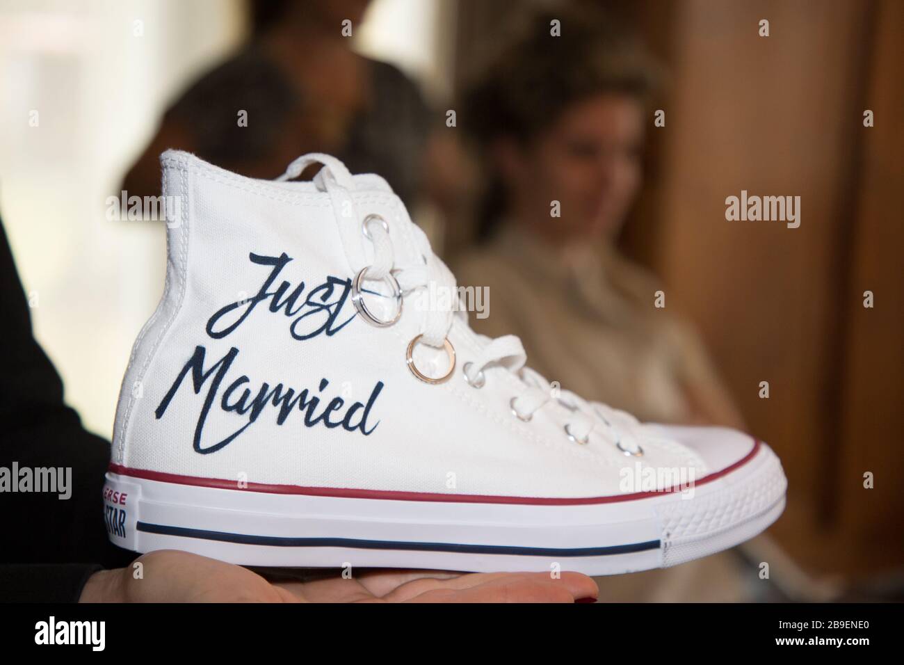 Bordeaux , Aquitaine / France - 01 15 2020 : Bride wedding rings in just  married white Sneakers converse all star chuck taylor in wedding prepation  ba Stock Photo - Alamy