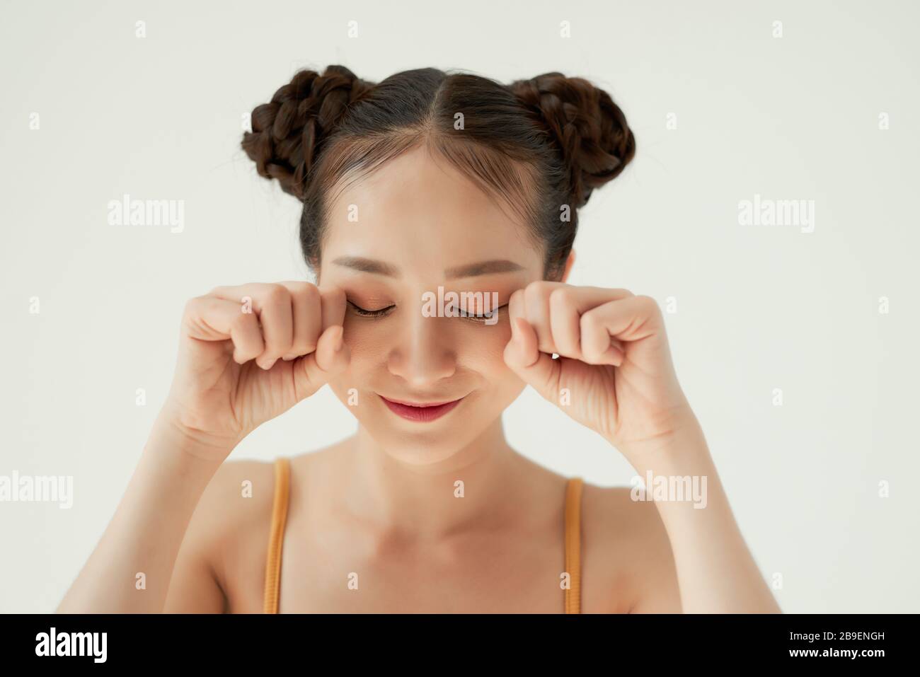 portrait of her she nice-looking attractive lovely teen girl closed eyes grief dislike disgust over light background. Stock Photo
