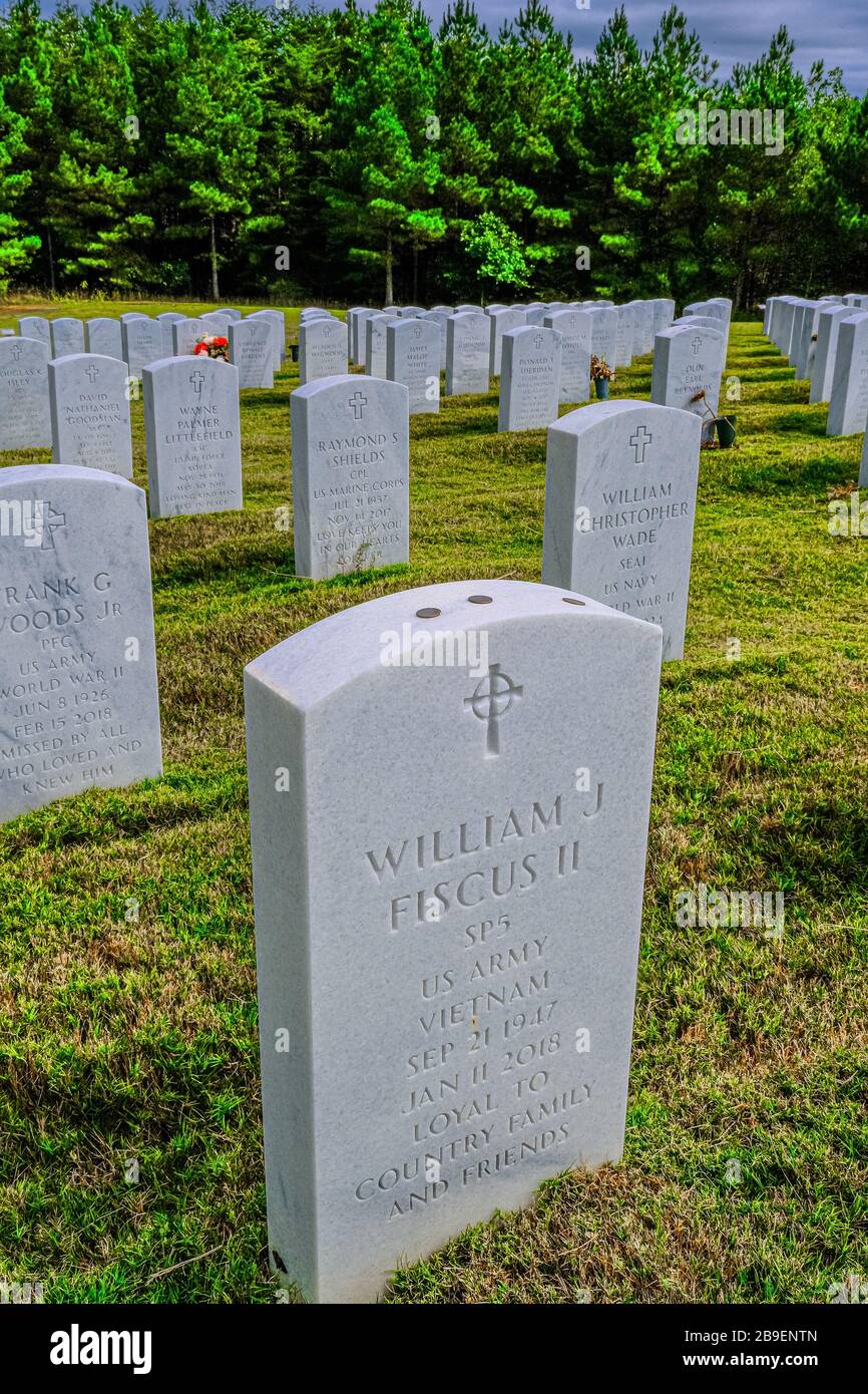 Three Coins on Headstone Stock Photo Alamy