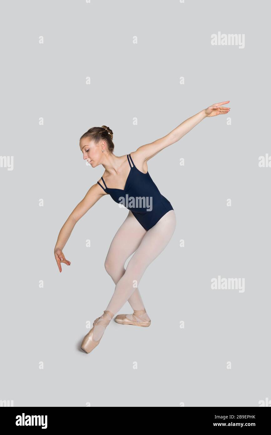 Young ballerina practising ballet moves in the studio Stock Photo - Alamy
