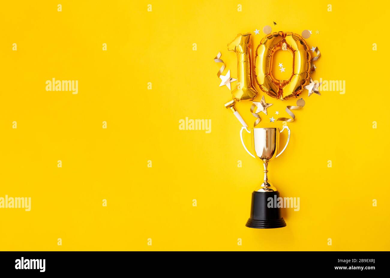 Number 10 gold anniversary celebration balloon exploding from a winning ...