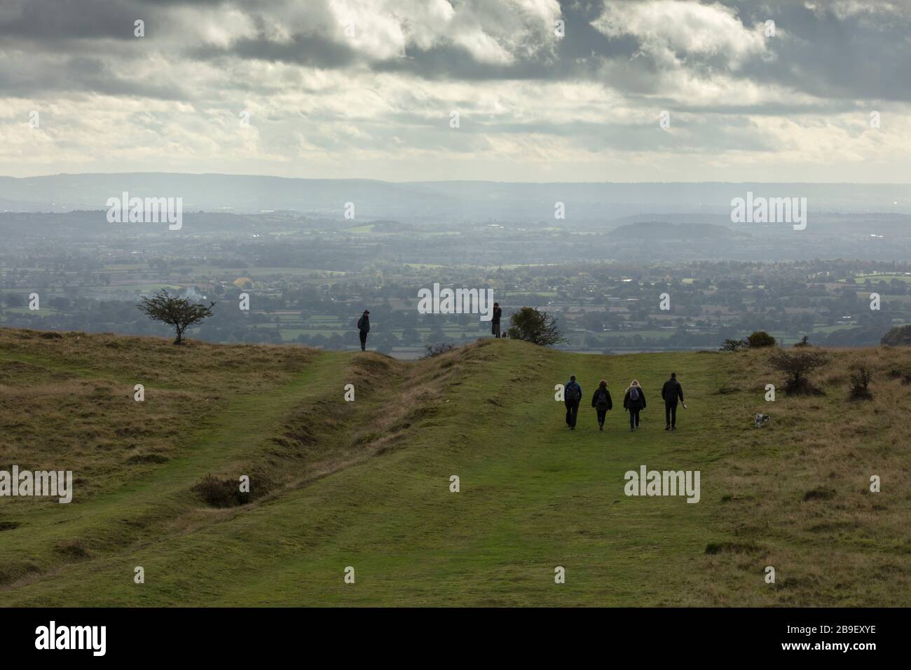 Walkers on Millennium Hill, Malvern Hills, Worcestershire. Stock Photo