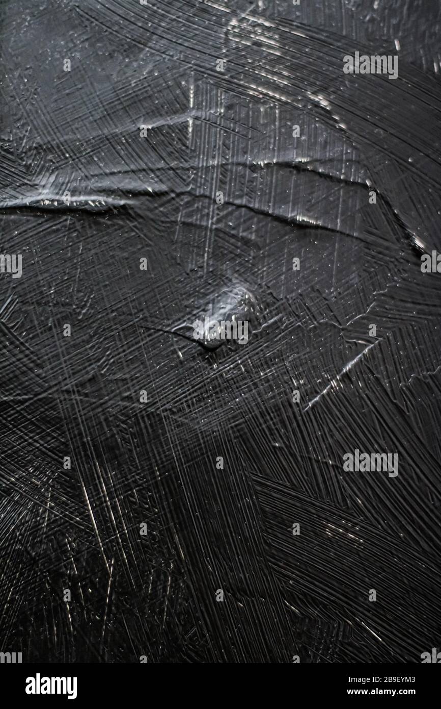 Dark gray background, charcoal paint texture as abstract backdrop