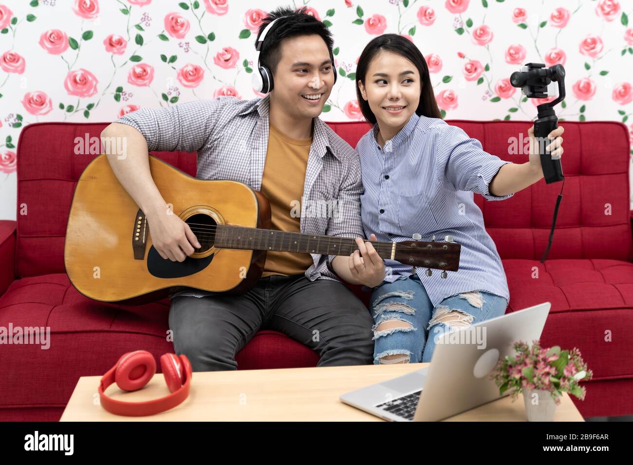 Duo singer do vlog live singing song with guitar to share on social media. Using for vlog social media influencer concept. Stock Photo