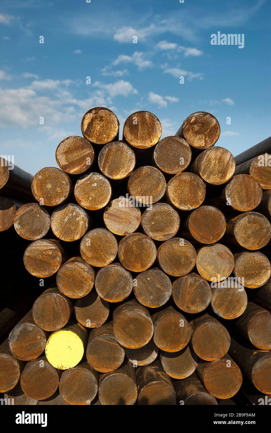 Raw material, steel, round steel in stock, metal Stock Photo