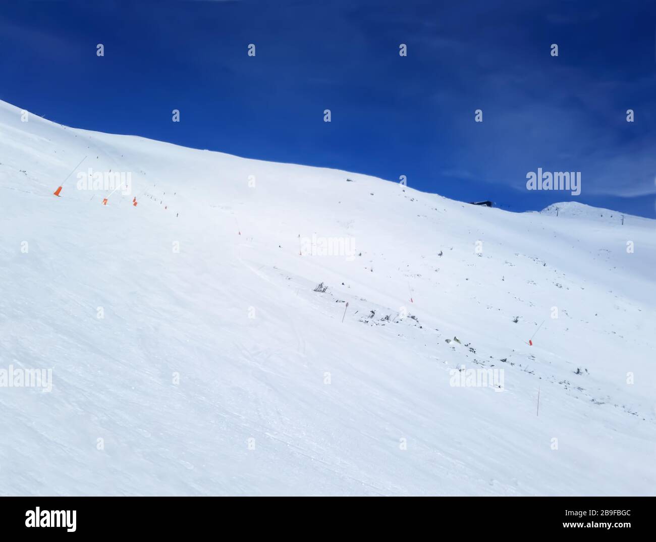 Jasna, Slovakia - January 22, 2019: Blue sky, cableway, skiers and panoramic view on the mountain slope in Low Tatras on a winter sunny day on the Jas Stock Photo