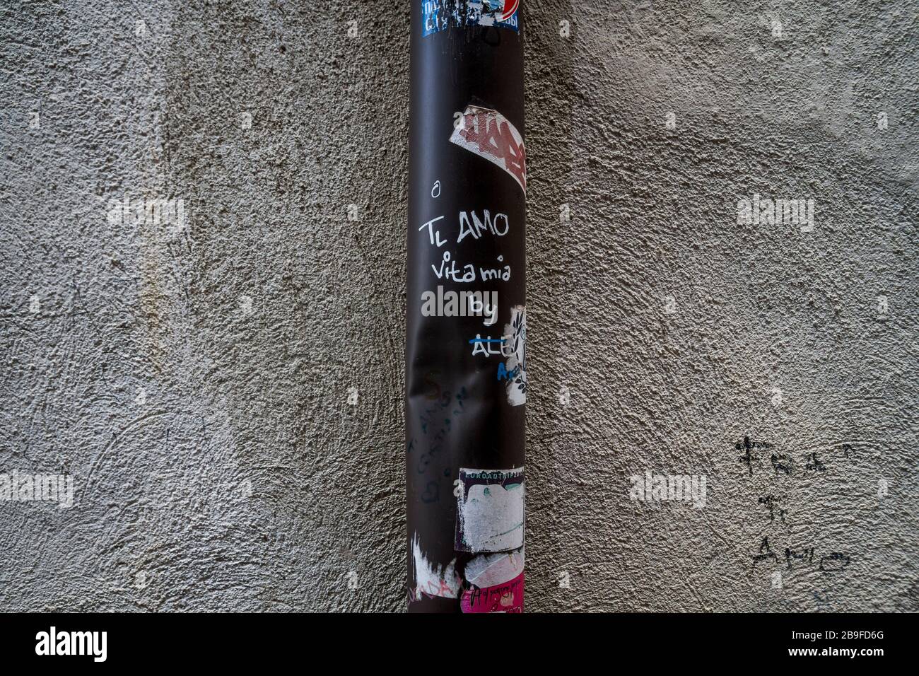 Love graffiti written on a metal pipe in Verona, Italy Stock Photo