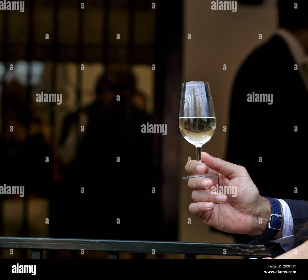 Hand holding glass of fino sherry (manzanilla sherry) at the April Fair