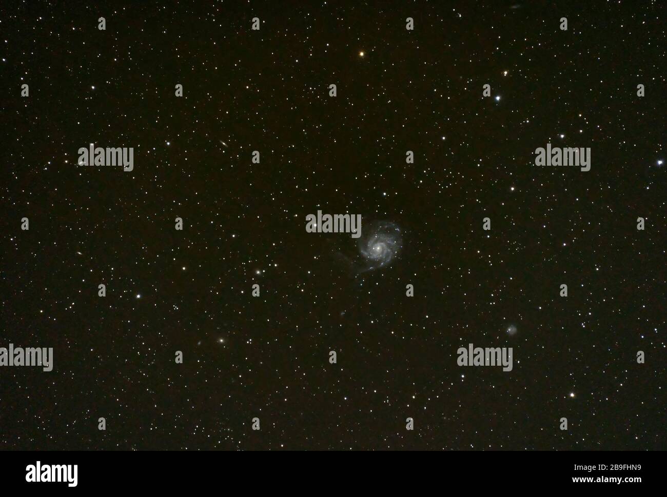 Pinwheel galaxy in the night sky shot at 600mm Stock Photo