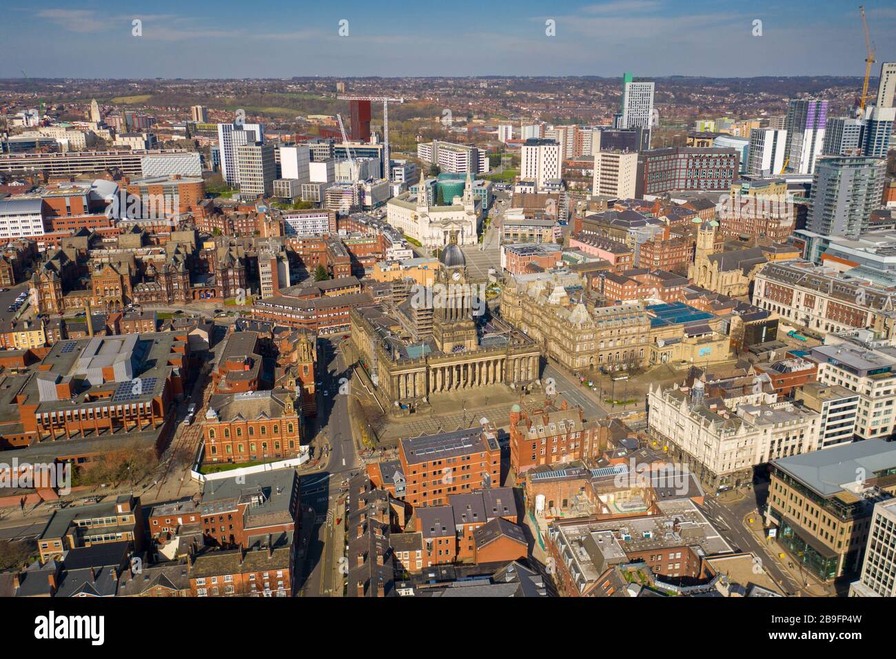 Aerial photo of the town centre of Leeds in West Yorkshire, taken on a beautiful sunny day showing the Leeds Town Hall Stock Photo