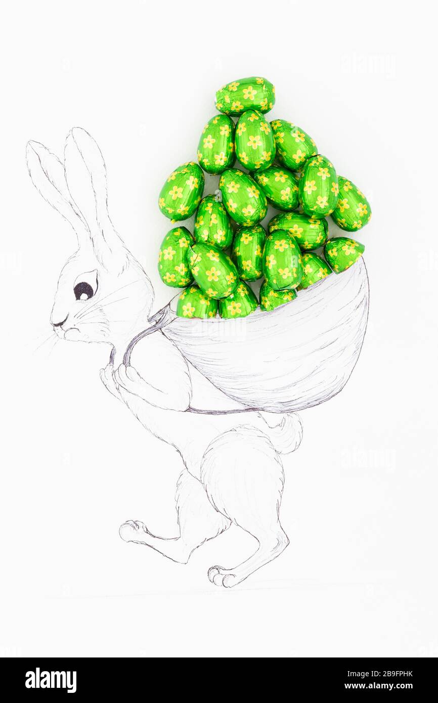 Hand drawn easter bunny carrying a huge backpack filled with real chocolate eggs wrapped in green aluminum foil. Stock Photo