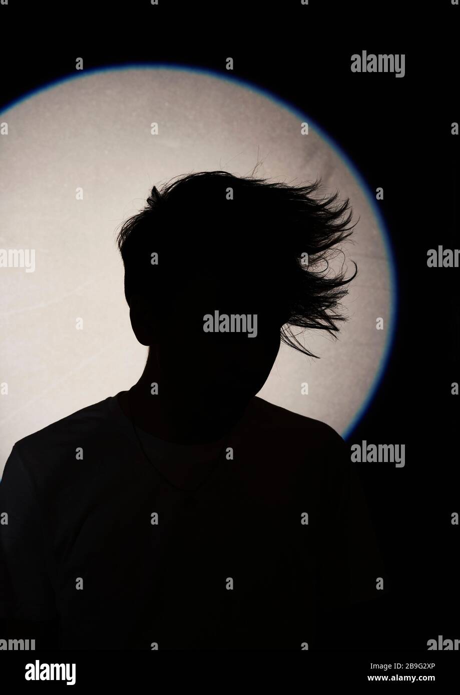 Silhouette man with textured hair Stock Photo