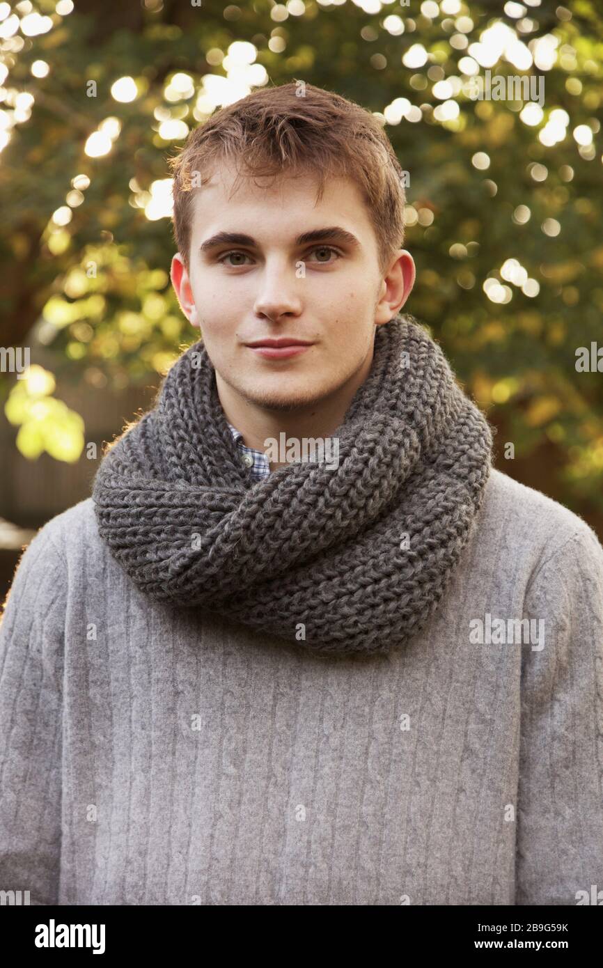 Portrait confident teenage boy with scarf Stock Photo