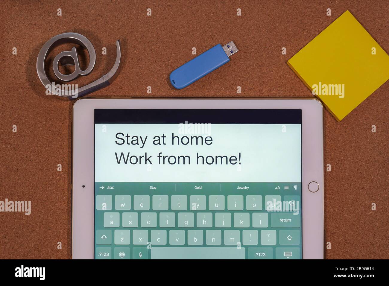 Work from home virus quarantine concept with mobile computer. POV of typed  stay at home message on a tablet, with a USB stick and yellow notes papers  Stock Photo - Alamy