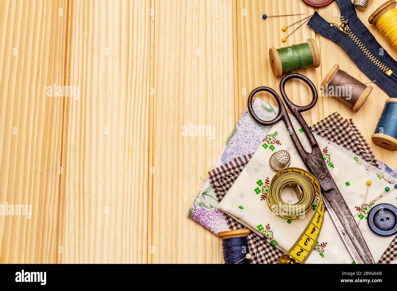 Handmade, DIY concept. Set of tools and materials for sewing. Stay at home  in quarantine. Wooden boards background, top view Stock Photo - Alamy