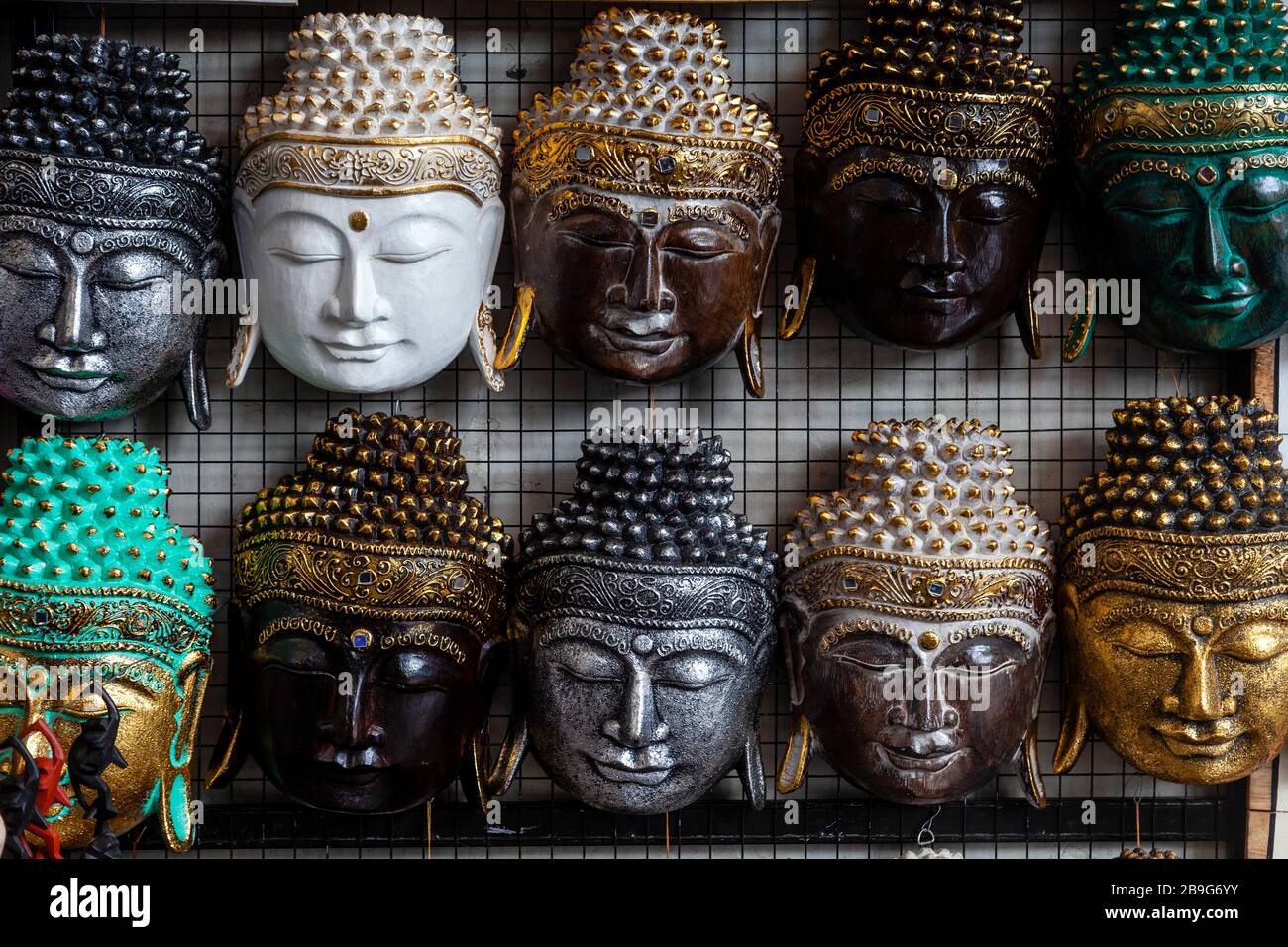 Buddha Masks On Sale At The Market, Ubud, Bali, Indonesia Stock Photo