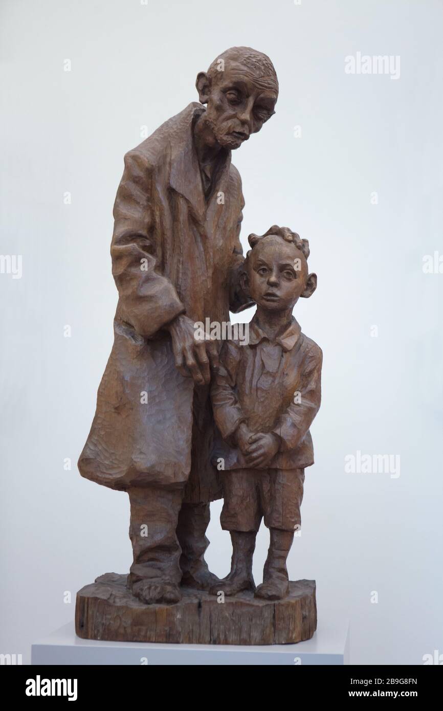 Wooden sculpture 'Blind Man with a Boy' by German sculptor Christoph Voll (1926) on display in the Staatliche Kunsthalle Karlsruhe (State Art Gallery) in Karlsruhe, Baden-Württemberg, Germany. Stock Photo