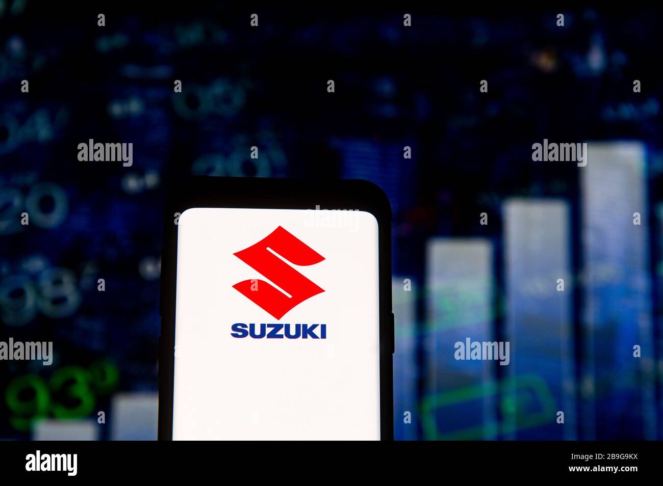 In this photo illustration a Suzuki logo seen displayed on a smartphone. Stock Photo