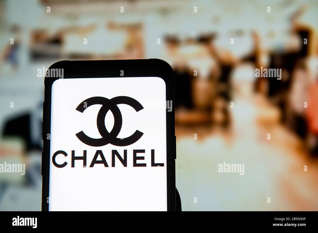 In this photo illustration a Chanel logo seen displayed on a smartphone. Stock Photo
