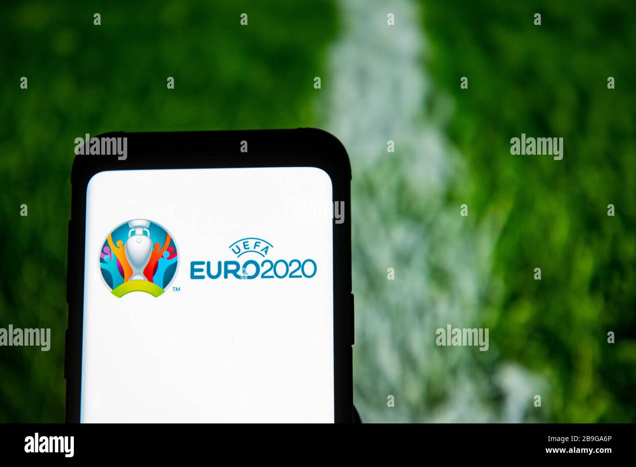 In this photo illustration the UEFA Euro 2020 logo seen displayed on a smartphone. Stock Photo