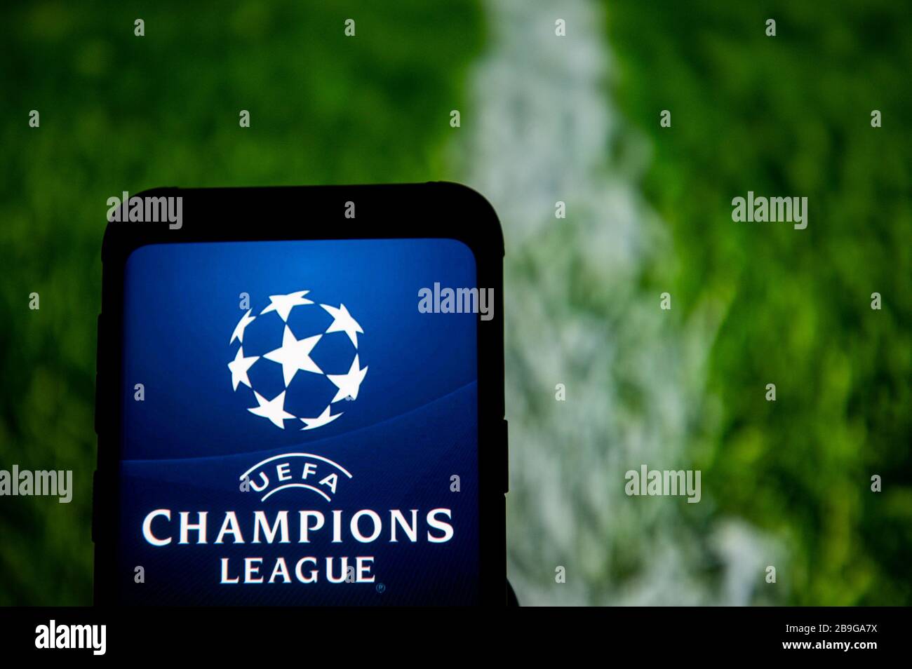 In this photo illustration the UEFA Champions League logo seen displayed on  a smartphone Stock Photo - Alamy