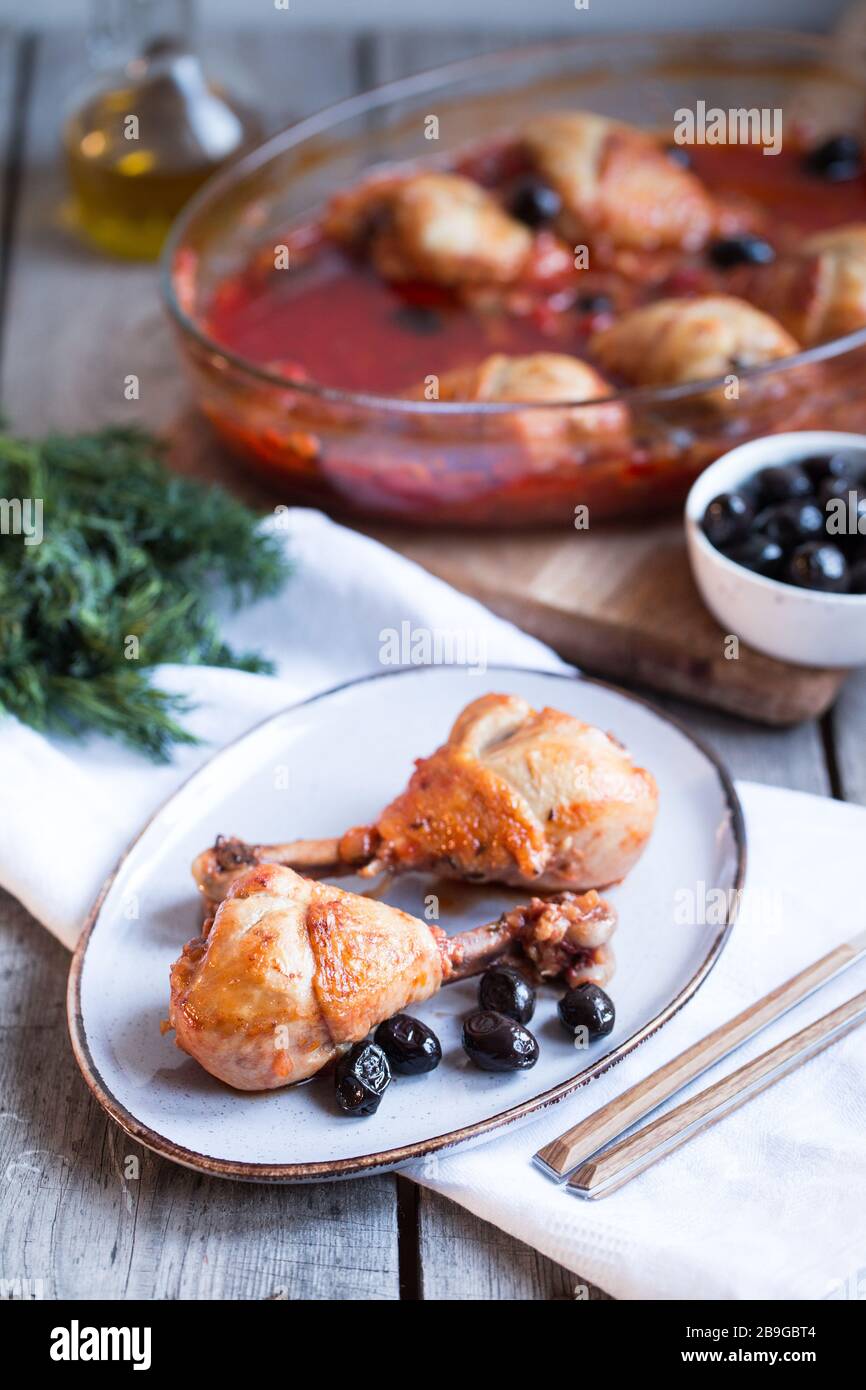 Chicken Cacciatore braised with wine, olives and tomatoes, traditional Italian dish Stock Photo