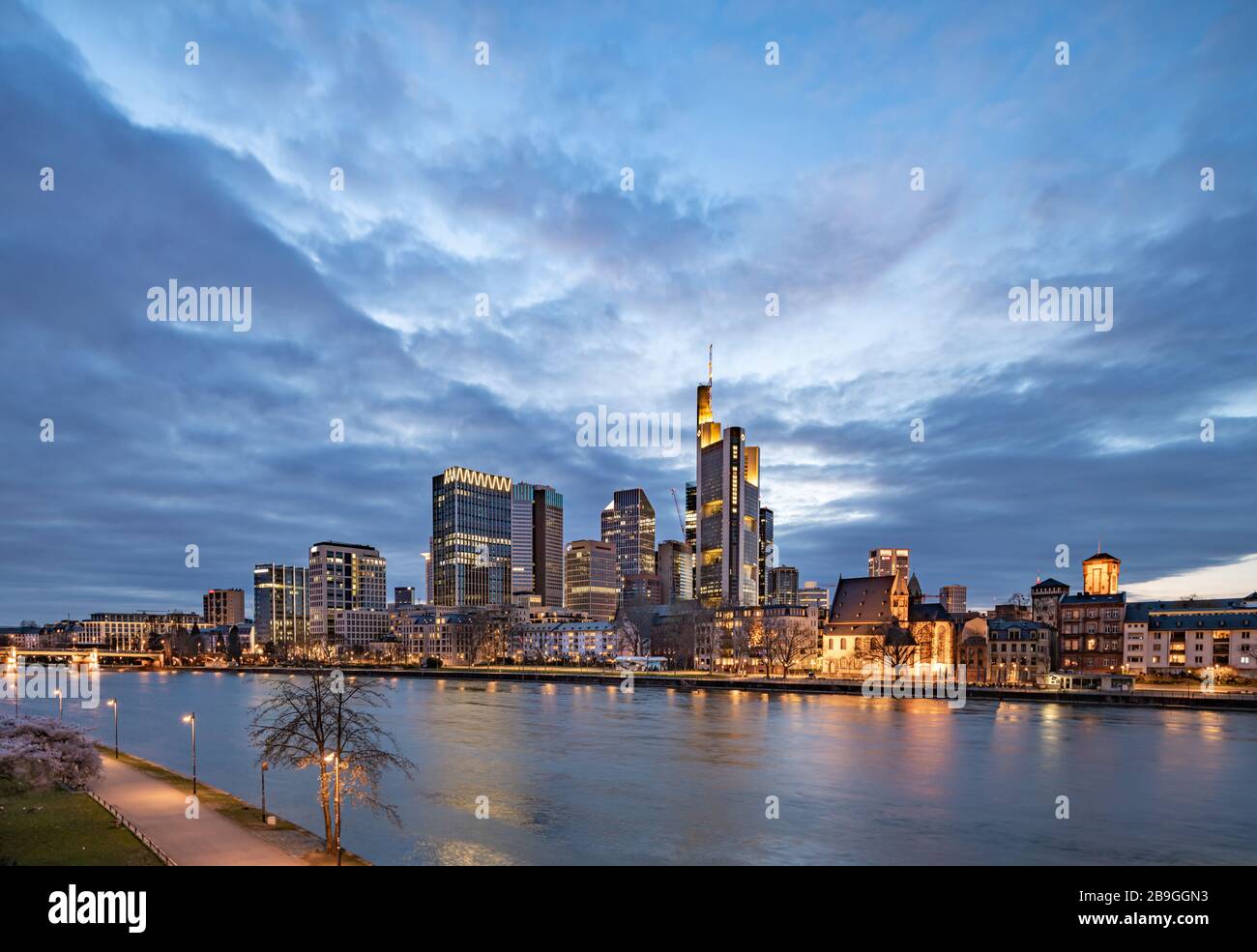color image Frankfurt am Main skyline at sunset, reflection on the banks of the Main Stock Photo