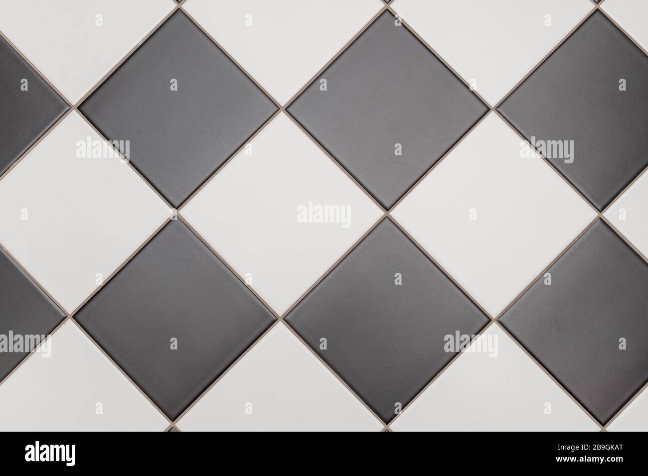 Bathroom tiles in black and white laid out in a diamond pattern Stock