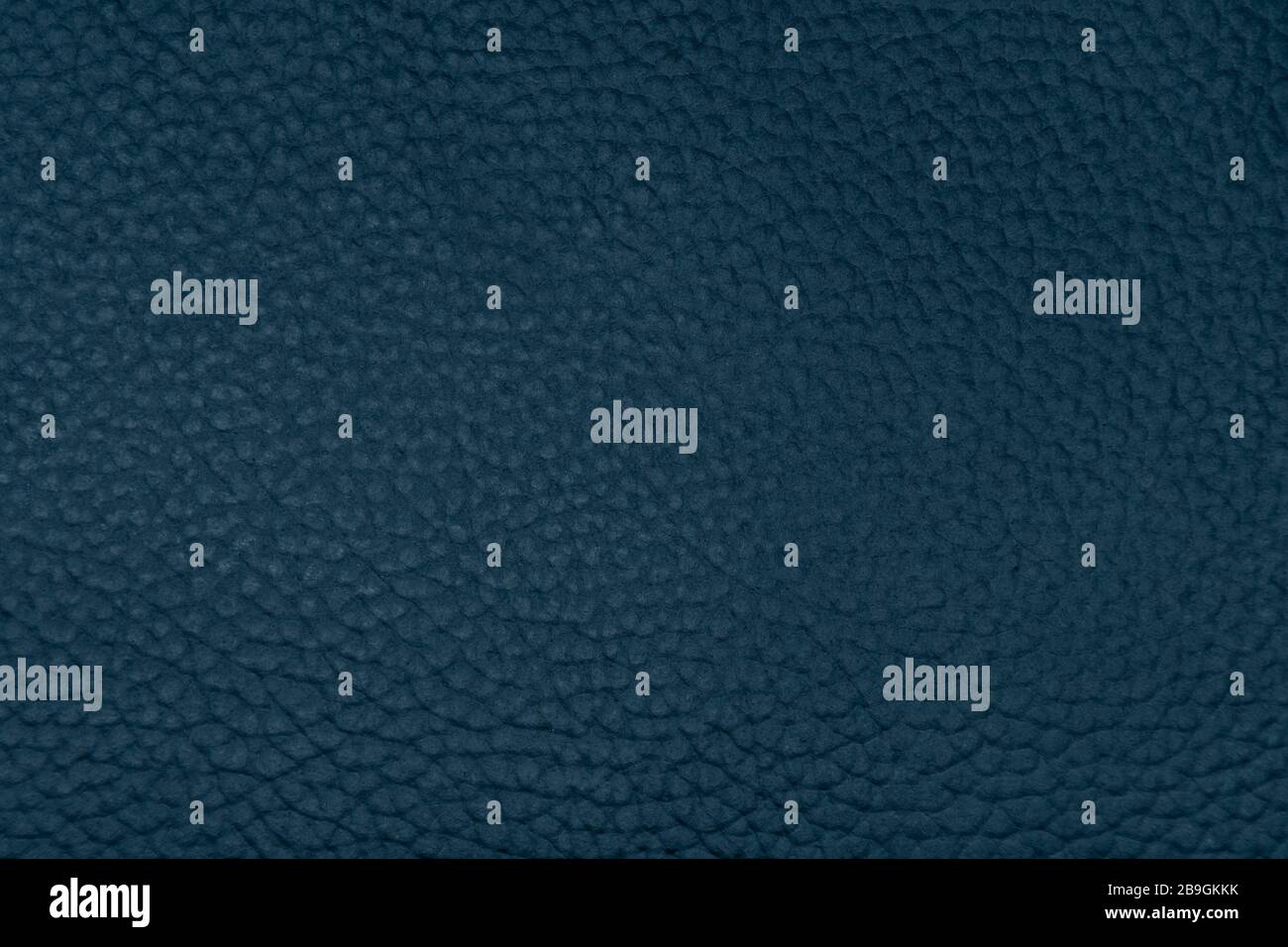 Dark blue or grey leather close up as texture and background Stock Photo