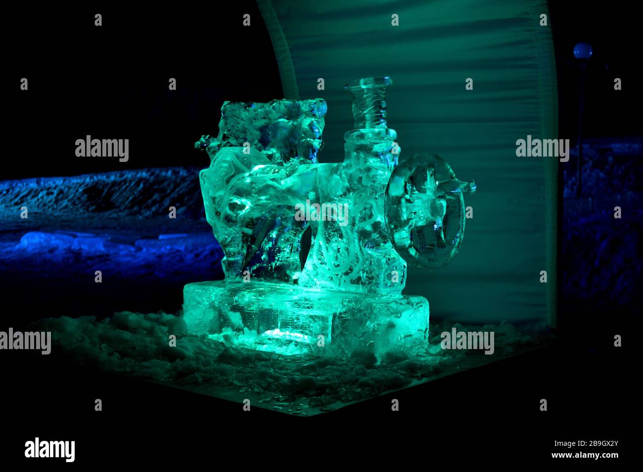 Ice sculpture of sewing machine lights in the night Stock Photo - Alamy