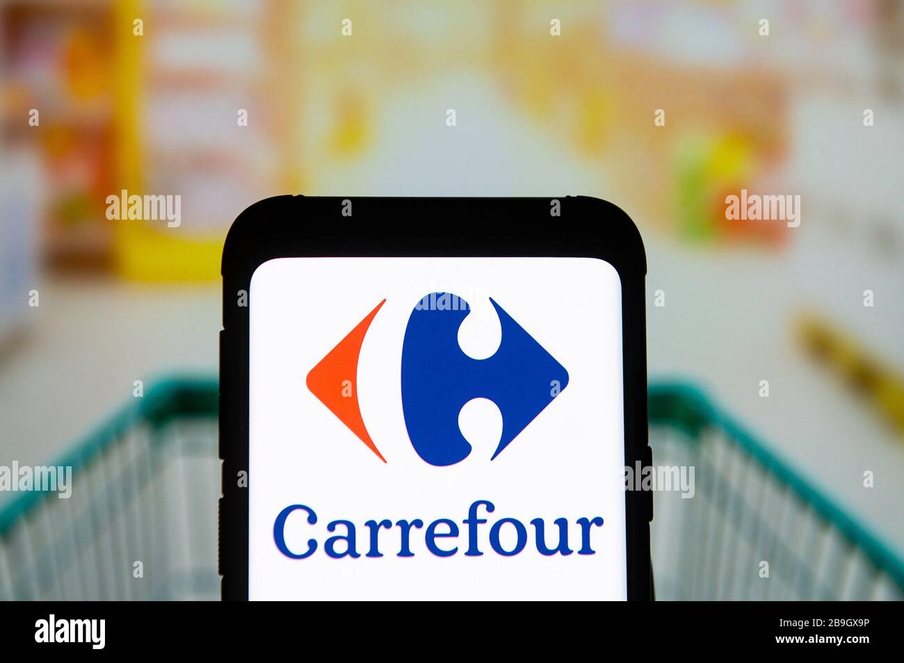 March 23, 2020, Poland: In this photo illustration a Carrefour logo seen displayed on a smartphone. (Credit Image: © Mateusz Slodkowski/SOPA Images via ZUMA Wire) Stock Photo