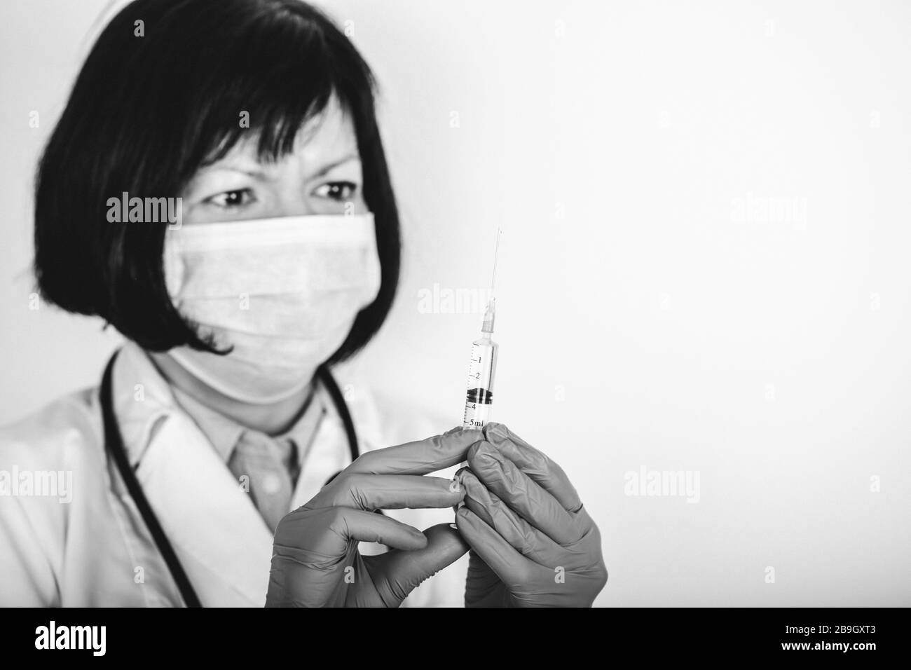 Doctor in medical coat mask Black and White Stock Photos & Images - Alamy