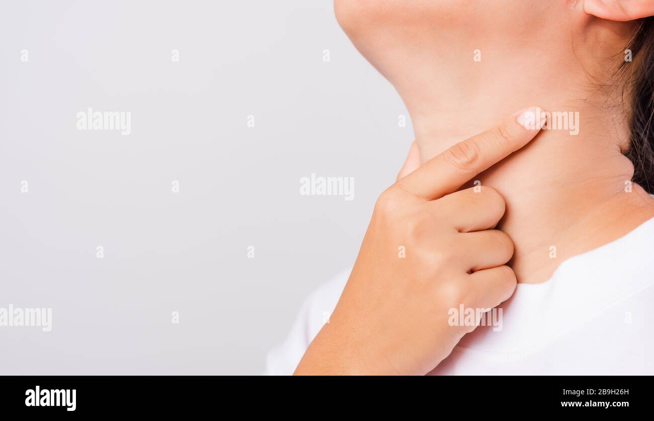Asian beautiful woman Sore Throat or thyroid gland problem her useing Hand Touching Ill Neck on white background with copy space, Medical and Healthca Stock Photo - Alamy Asian beautiful woman Sore Throat or thyroid gland problem her useing Hand Touching Ill Neck on white background with copy space, Medical and Healthca Stock Photo - Alamy