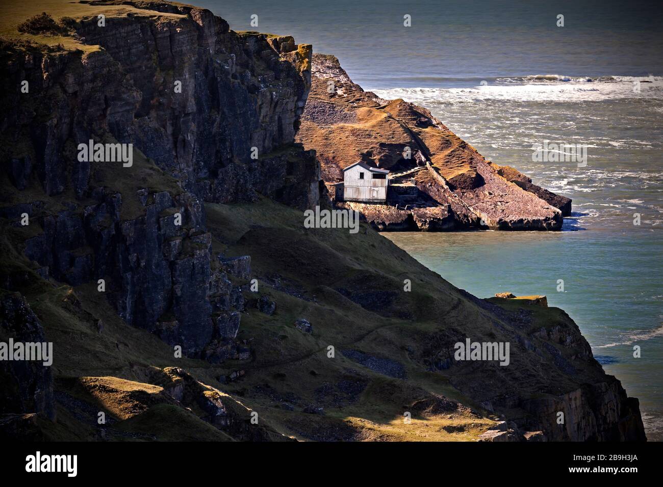 Deserted boathouse at Worm's Head, Gower Peninsula, Wales, UK Stock Photo