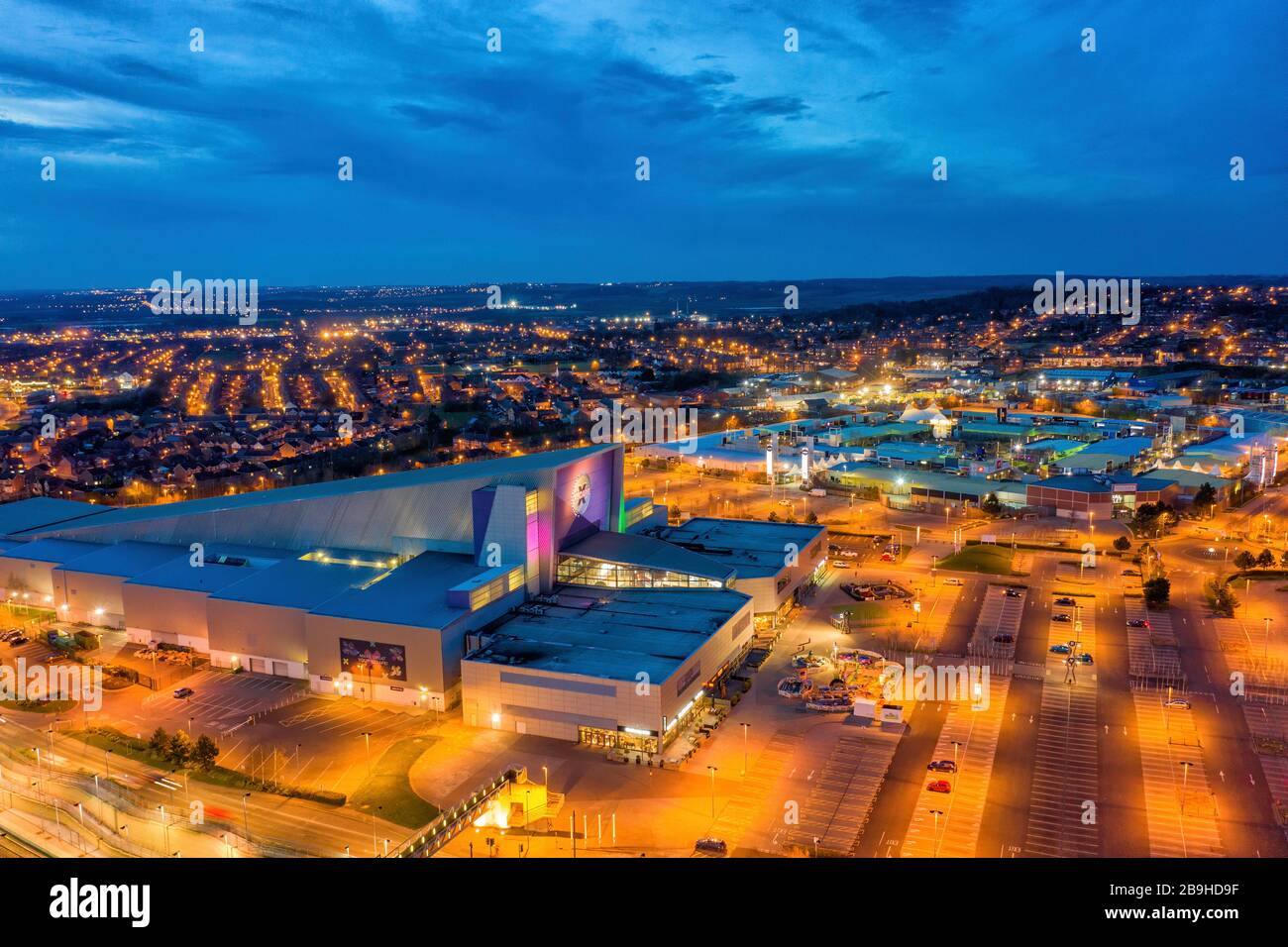 Xscape indoor ski area and leisure building Castleford West Yorkshire close to junction 32 and the retail outlet, aerial photograph at dusk Stock Photo