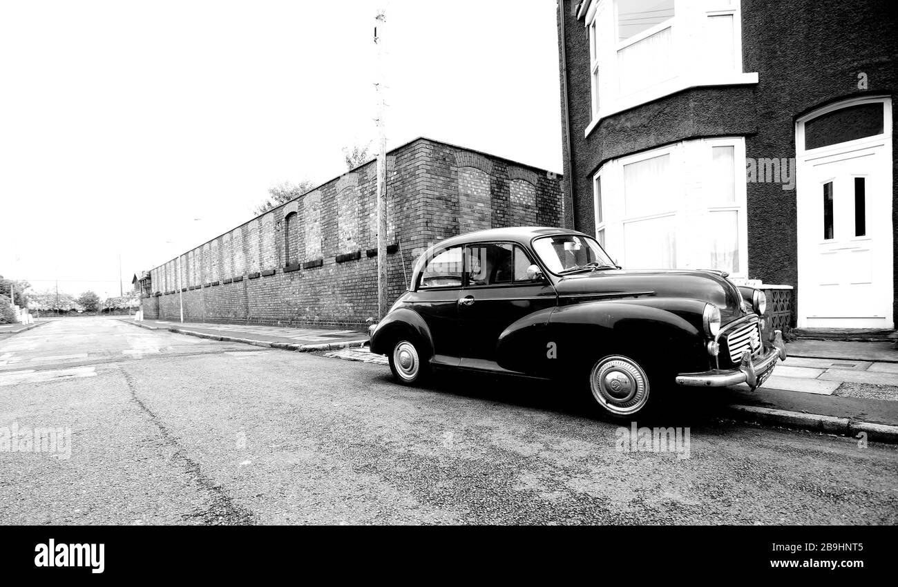 Classic car on a working class street near the Docks in Liverpool, England, UK Stock Photo