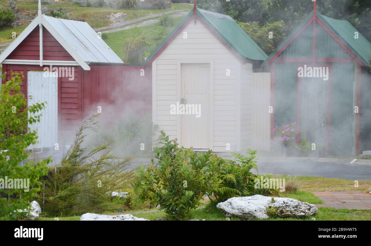 Colorful wooden houses with steam in Rotorua, New Zealand Stock Photo