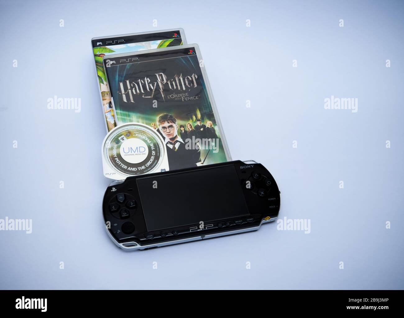 Italy - march 17, 2020: Sony UMD disk Harry Hotter game and  Playstation Portable. Stock Photo