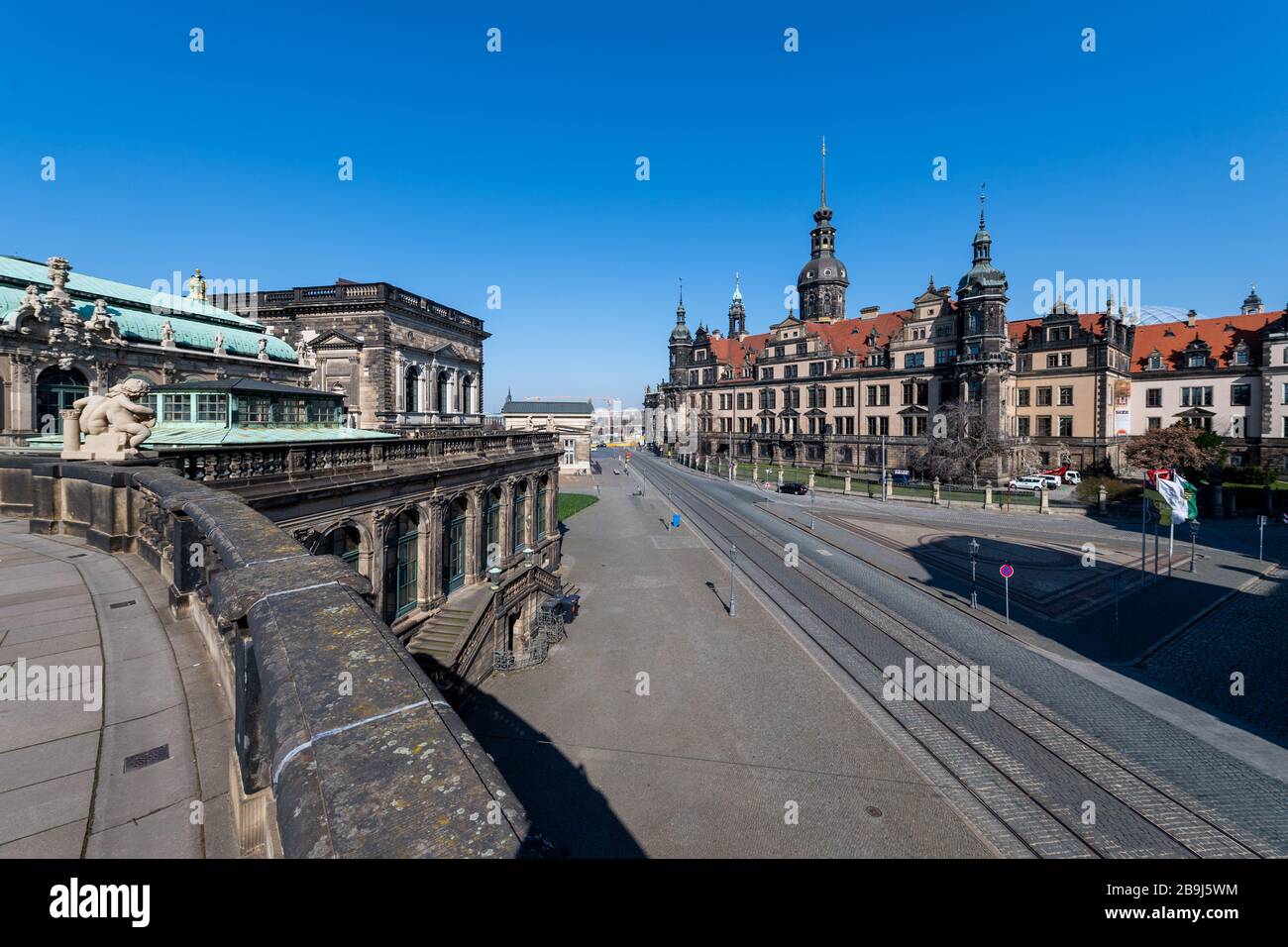 24 March 2020, Saxony, Dresden: The streets in front of the residential castle with the Hausmannsturm are deserted. To contain the coronavirus, Saxony now bans all gatherings of three or more people in public. Photo: Robert Michael/dpa-Zentralbild/dpa Stock Photo