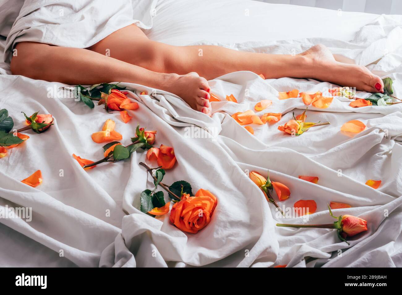Woman On Bed Rose Petals High Resolution Stock Photography And Images Alamy