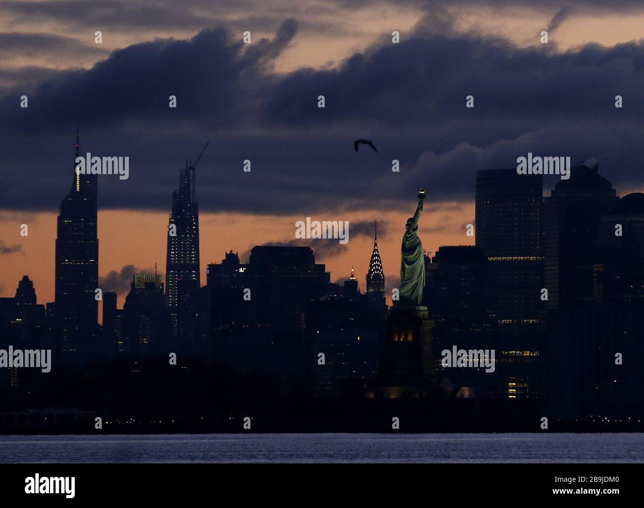 The sun rises on the Empire State Building, The Chrysler Building, the Statue of Liberty and the Manhattan in New York City on Tuesday, March 24, 2020. New York City Mayor Bill de Blasio said the number of positive cases in the city was at 13,119 as of 6 p.m. on Monday.   Photo by John Angelillo/UPI Stock Photo