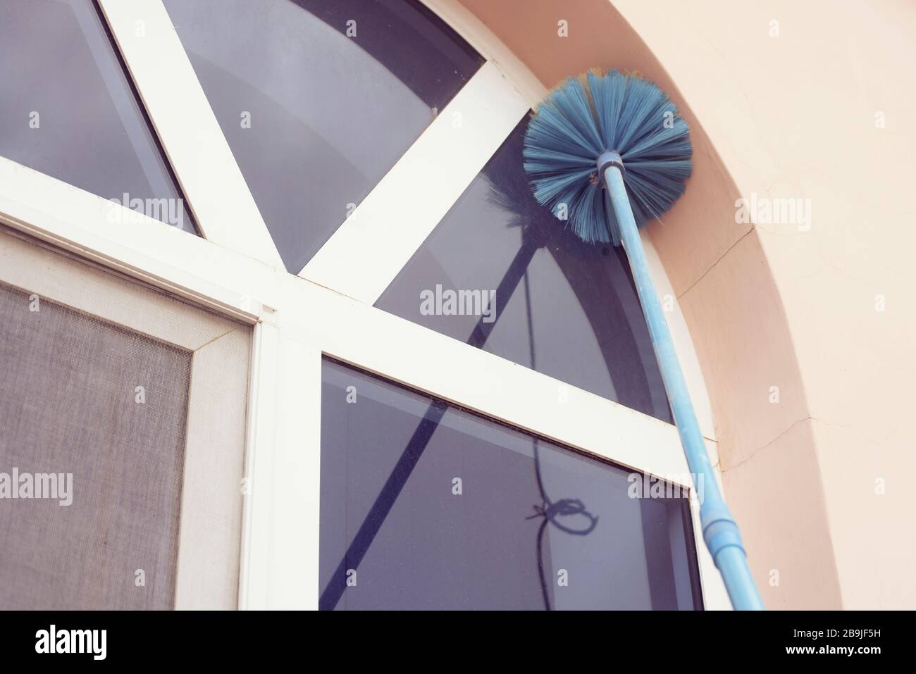 Cleaning window dust. Household Cleanup. Housekeeping jobs Stock Photo